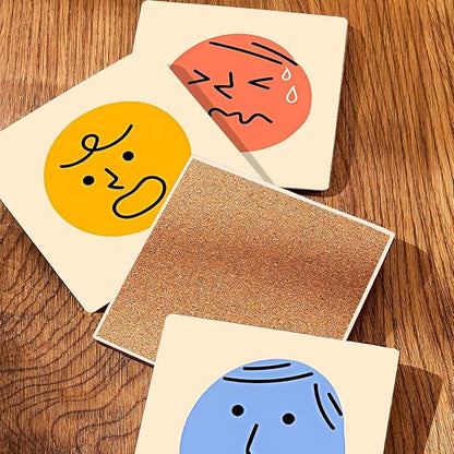 MAYCARI Cartoon Emotional Face Coasters Set of 6 Cork Backed Cute Coasters with Metal Holder Original Ceramic Surface Drink Cup Mats for Tabletop Protection Modern Desk Decoration Birthday Gifts