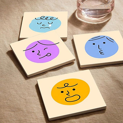MAYCARI Cartoon Emotional Face Coasters Set of 6 Cork Backed Cute Coasters with Metal Holder Original Ceramic Surface Drink Cup Mats for Tabletop Protection Modern Desk Decoration Birthday Gifts